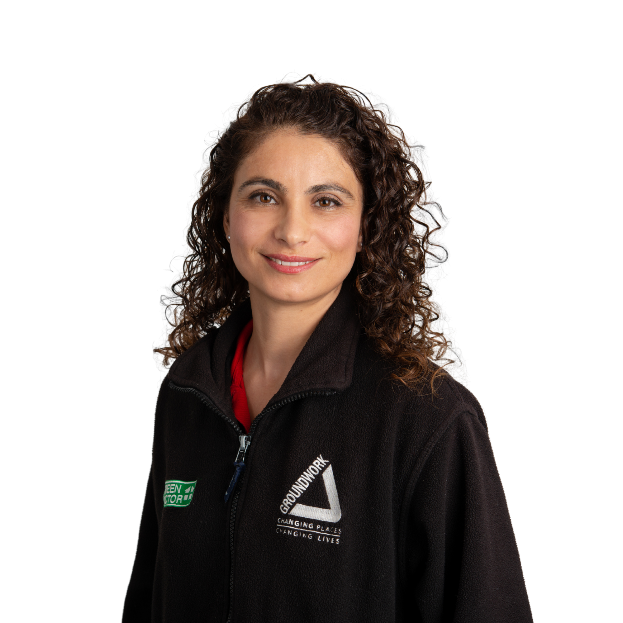 Female Green Doctor Smiling into Camera